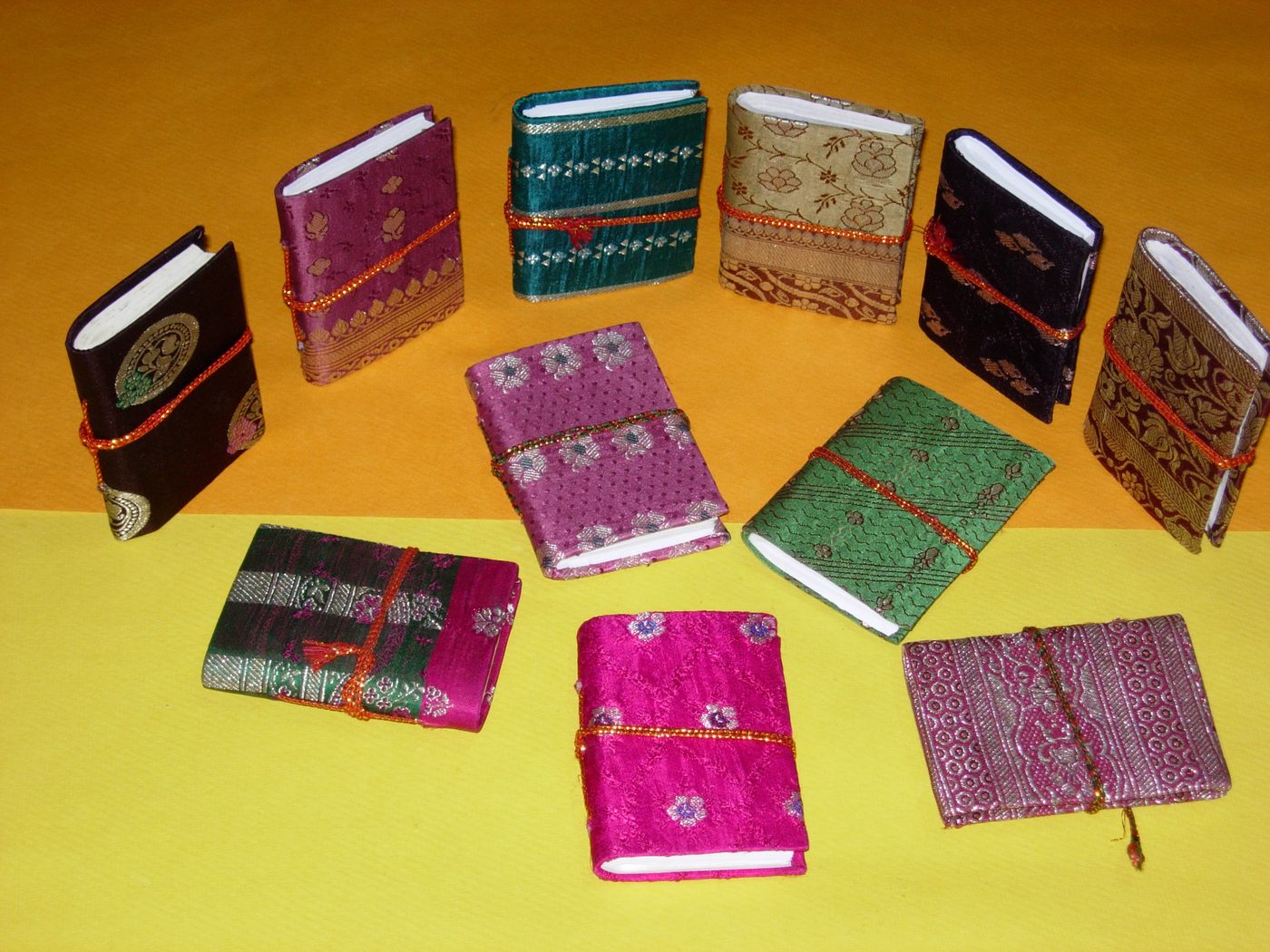 Zari-covered mini diaries